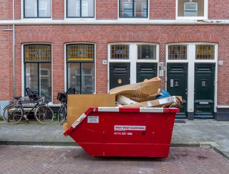 Waste clearance truck in Soho city center