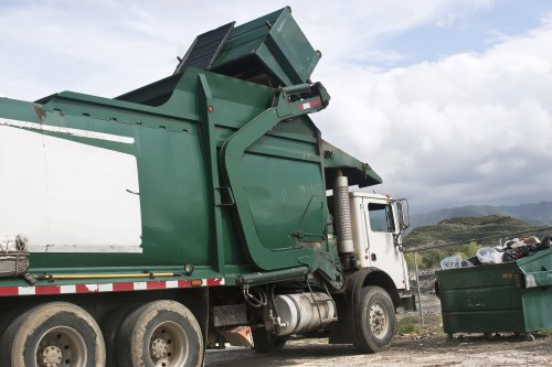 Team handling waste clearance in Berrylands with eco-friendly trucks