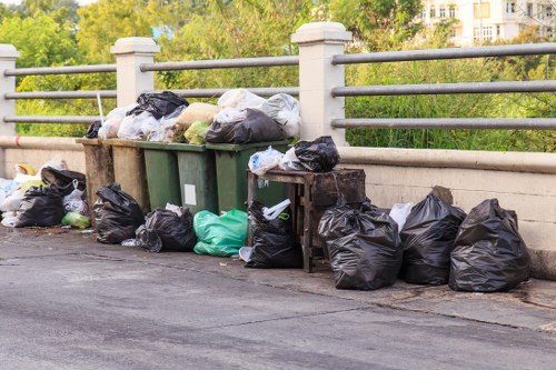 Modern rubbish removal truck in urban setting