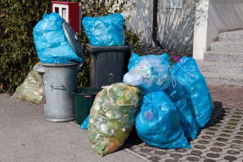 Local waste management team in Honor Oak with eco-friendly signage