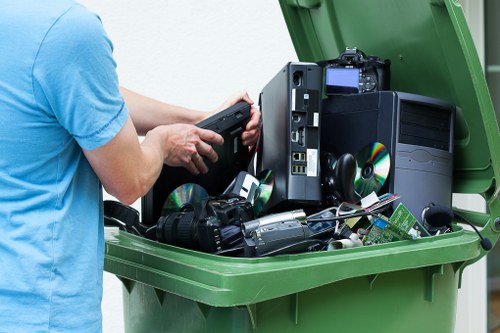 Waste clearance professionals working in St Johns with equipment