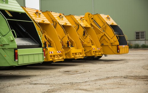 Professional waste clearance truck collecting debris