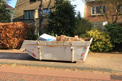 Recyclable materials being sorted as part of waste clearance in North Sheen