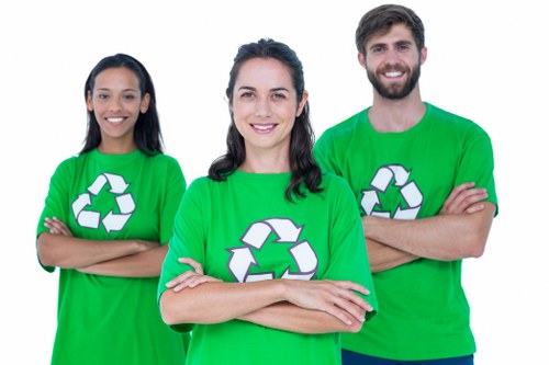 Local professionals handling waste removal equipment