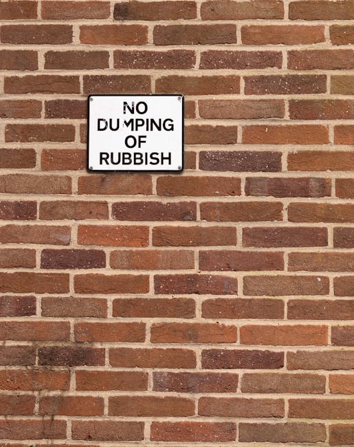 A photograph depicting a large pile of mixed household waste spread across a paved surface, possibly a driveway or street. The pile includes crumpled paper, plastic bottles with labels and caps, cardb
